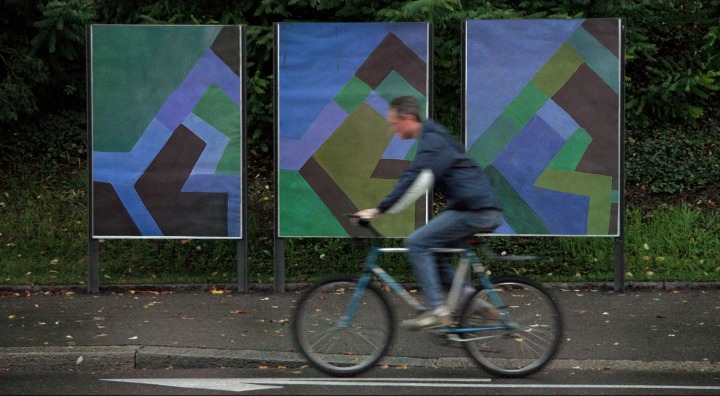 Cycling Past Street Signs